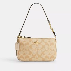 COACH NOLITA 19 IN BLOCKED SIGNATURE CANVAS